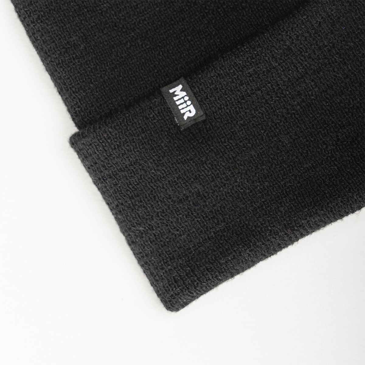 recycled-poly-fine-knit-beanie-a5 WebPDP-RecycledPolyFineKnitBeanie_Studio_TagDetail_Black__BNE005002OS.jpg