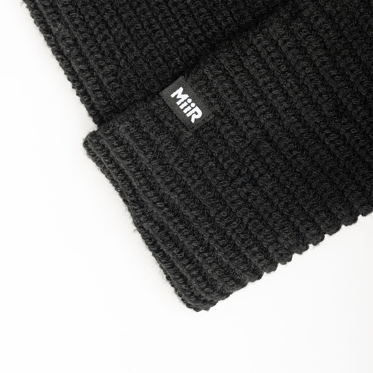 recycled-poly-rib-beanie-f3 WebPDP-RecycledPolyRibBeanie_Studio_TagDetail_Black__BNE002002OS.jpg
